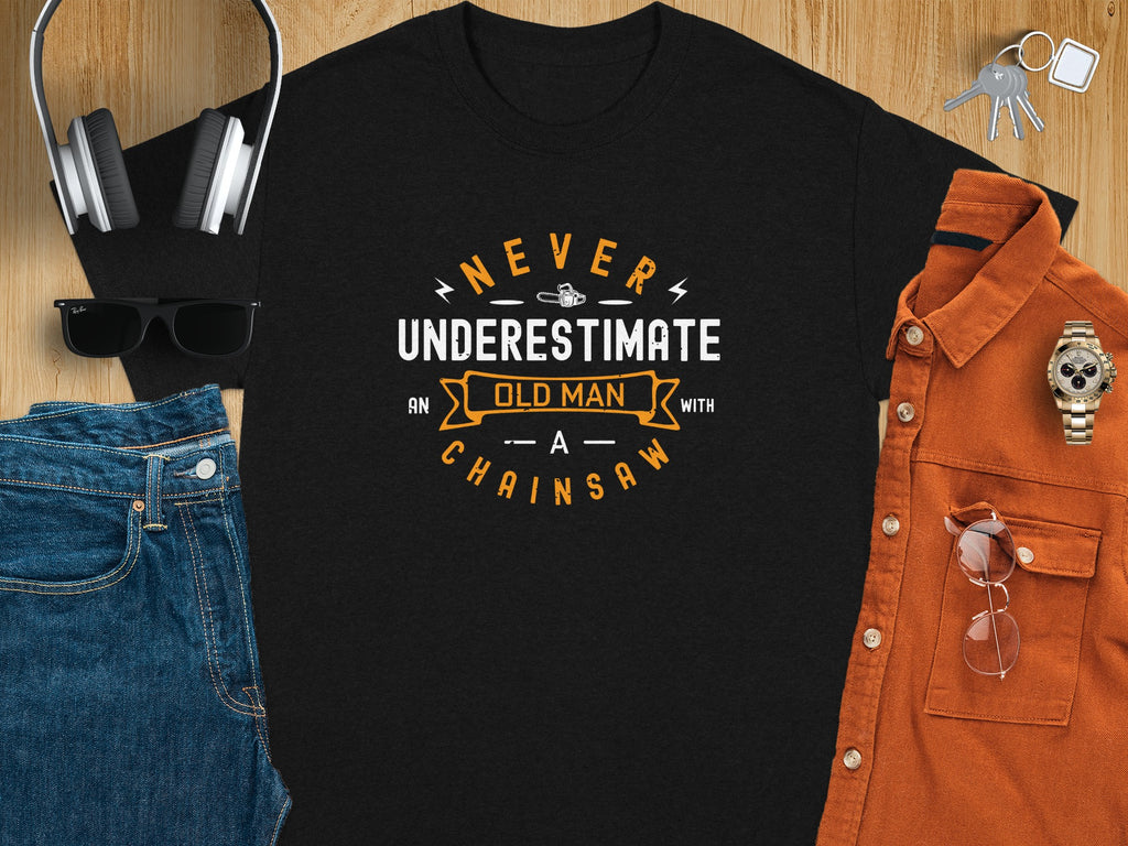 Black t-shirt with "Never Underestimate Old Man With A Chainsaw" text design.