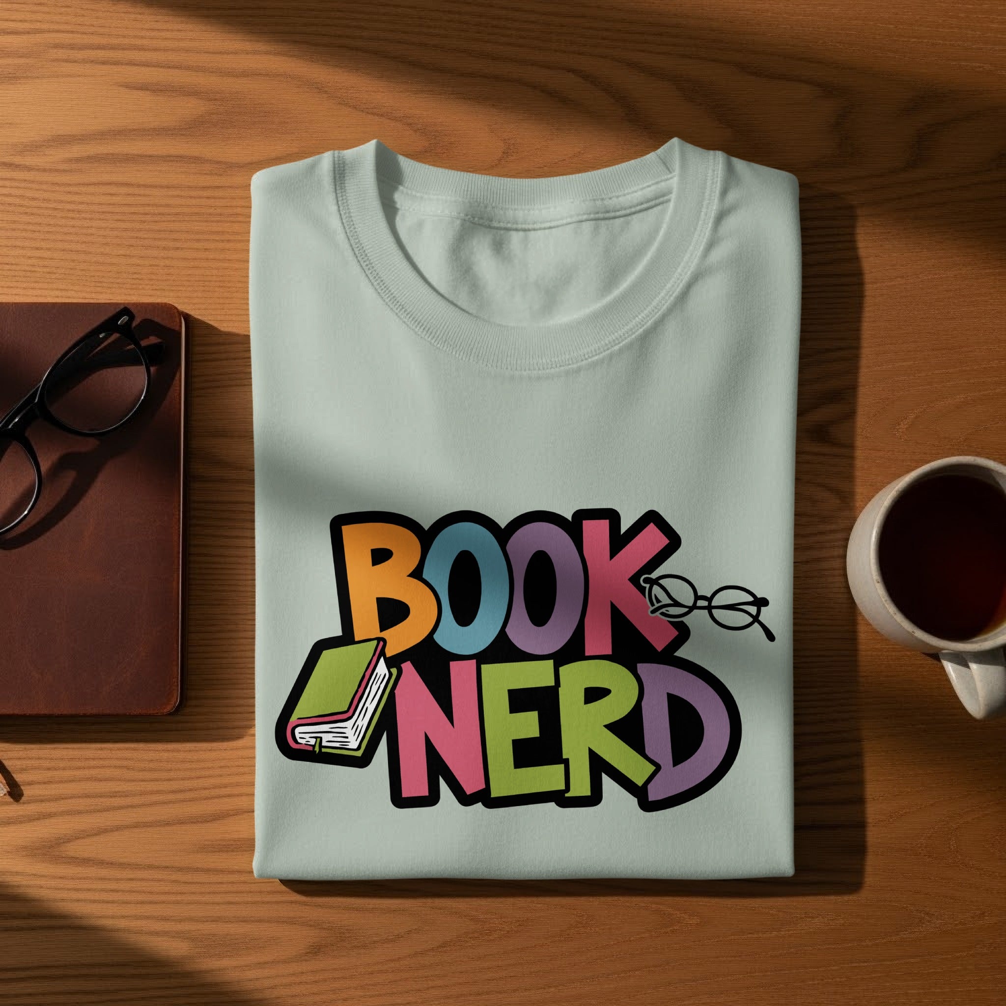Light blue t-shirt with colorful "BOOK NERD" text and graphics.