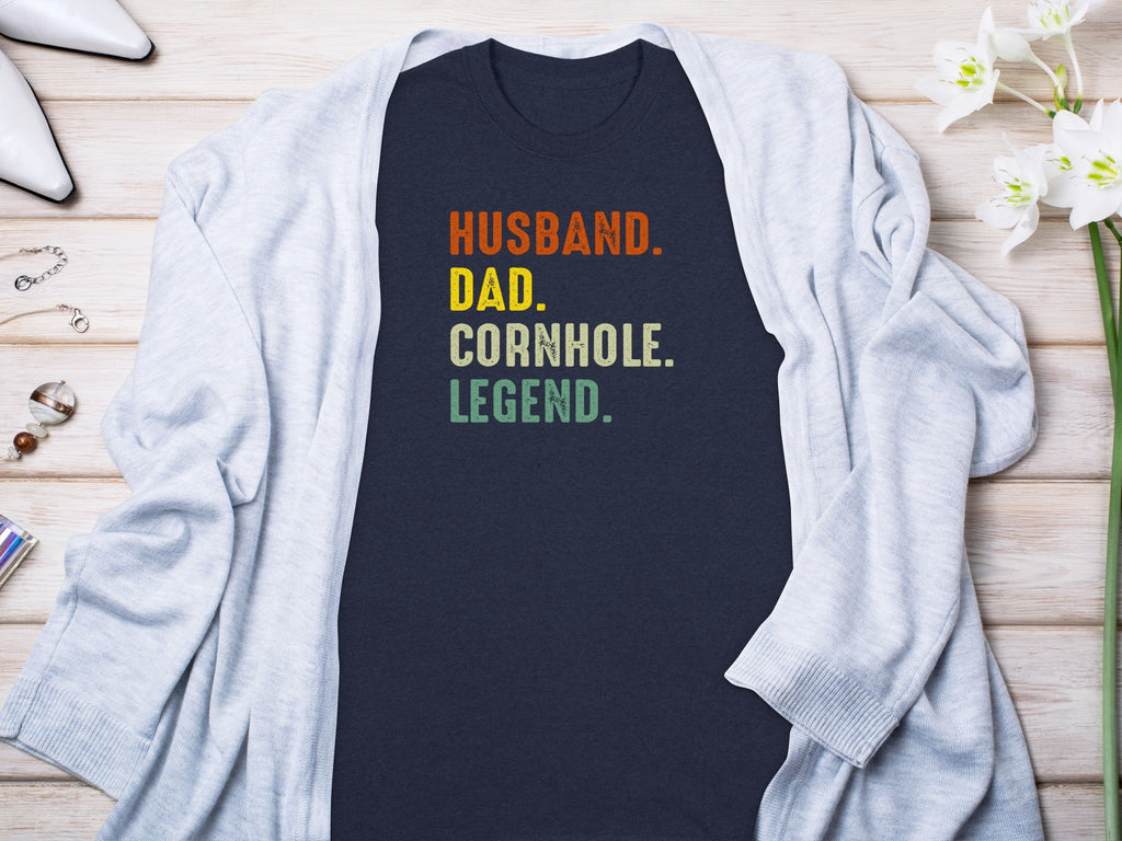 Dark blue t-shirt with text Husband. Dad. Cornhole. Legend.