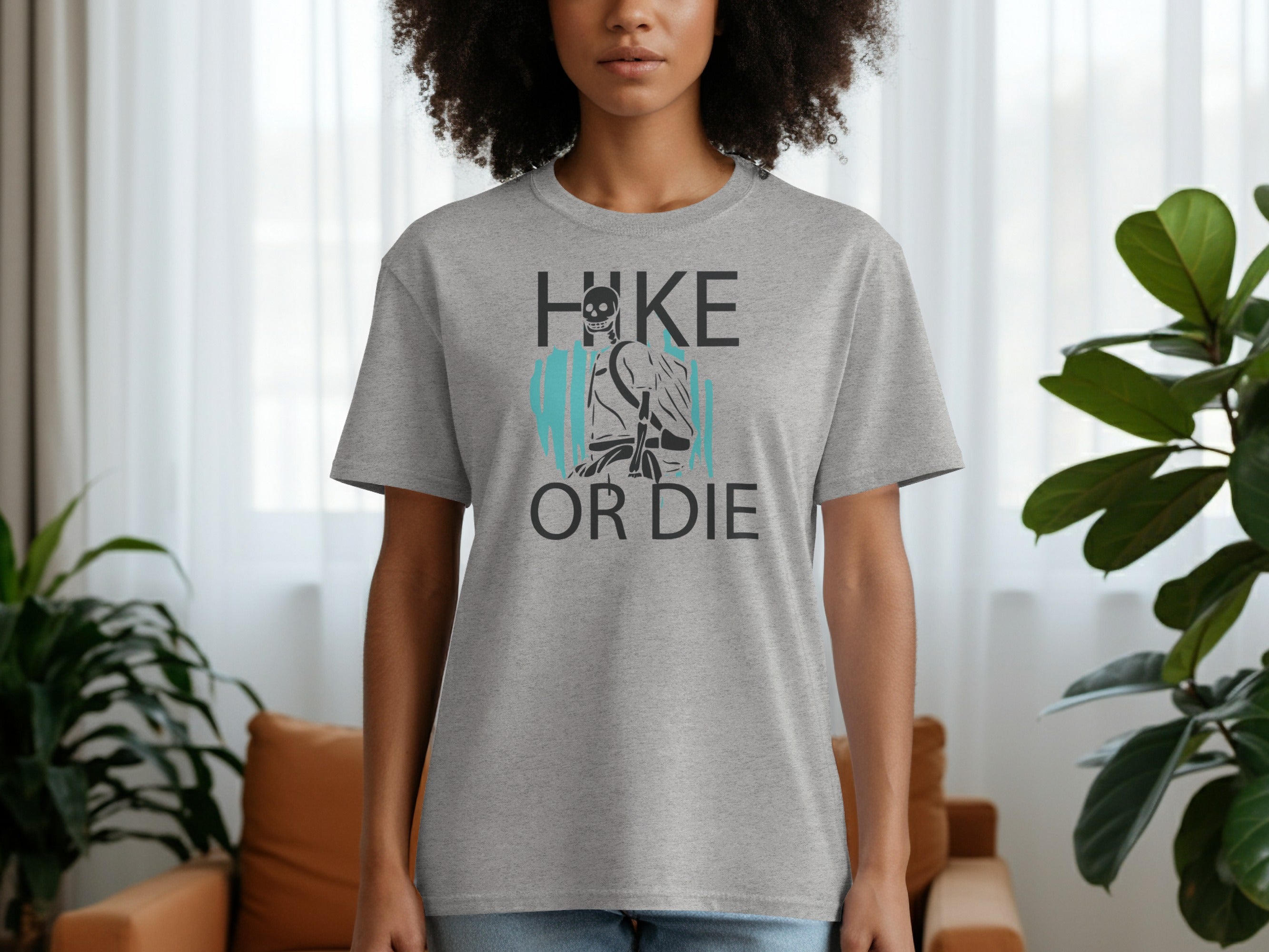 Grey t-shirt with "Hike Or Die" text and skeleton hiker graphic.