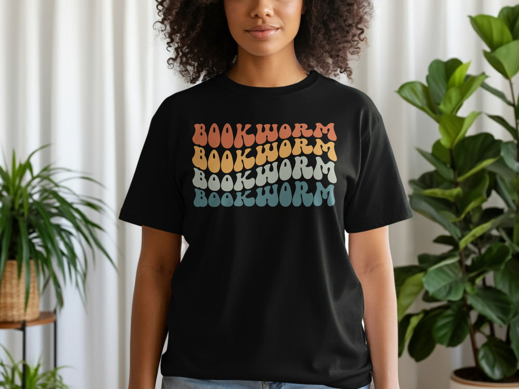 Black t-shirt with "BOOKWORM" text in wavy retro font, stacked and colored.