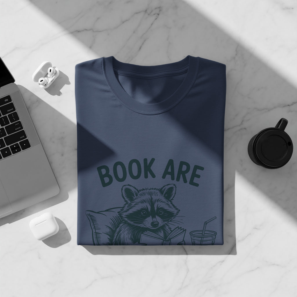 Navy t-shirt with raccoon reading a book and text "BOOK ARE"