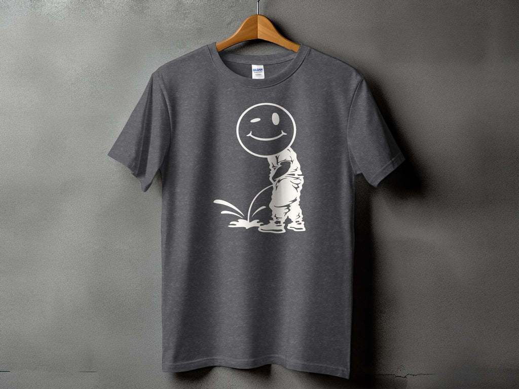 Dark gray t-shirt with a white graphic of a winking smiley face character urinating.