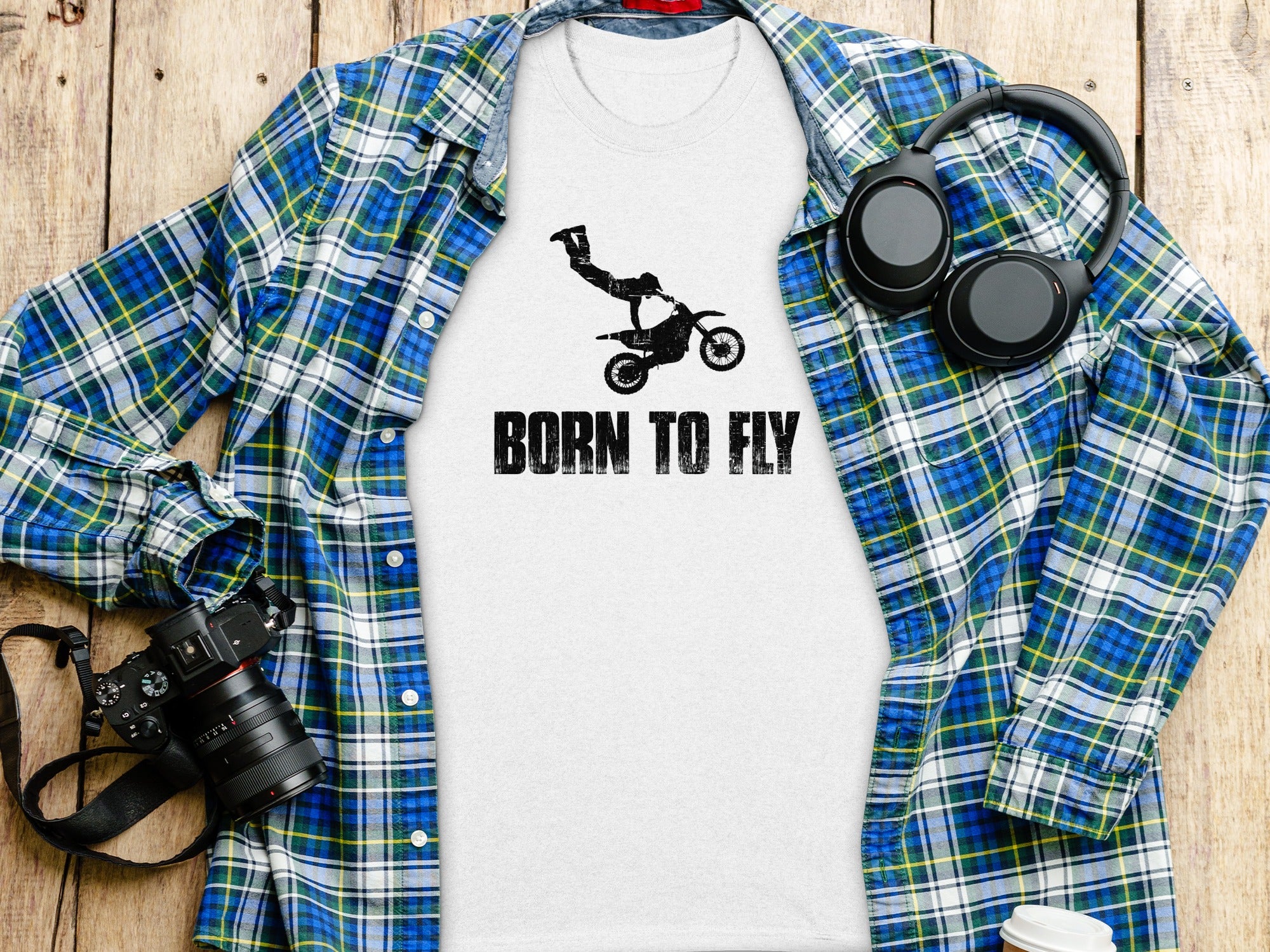 White t-shirt with motocross rider graphic and "BORN TO FLY" text.