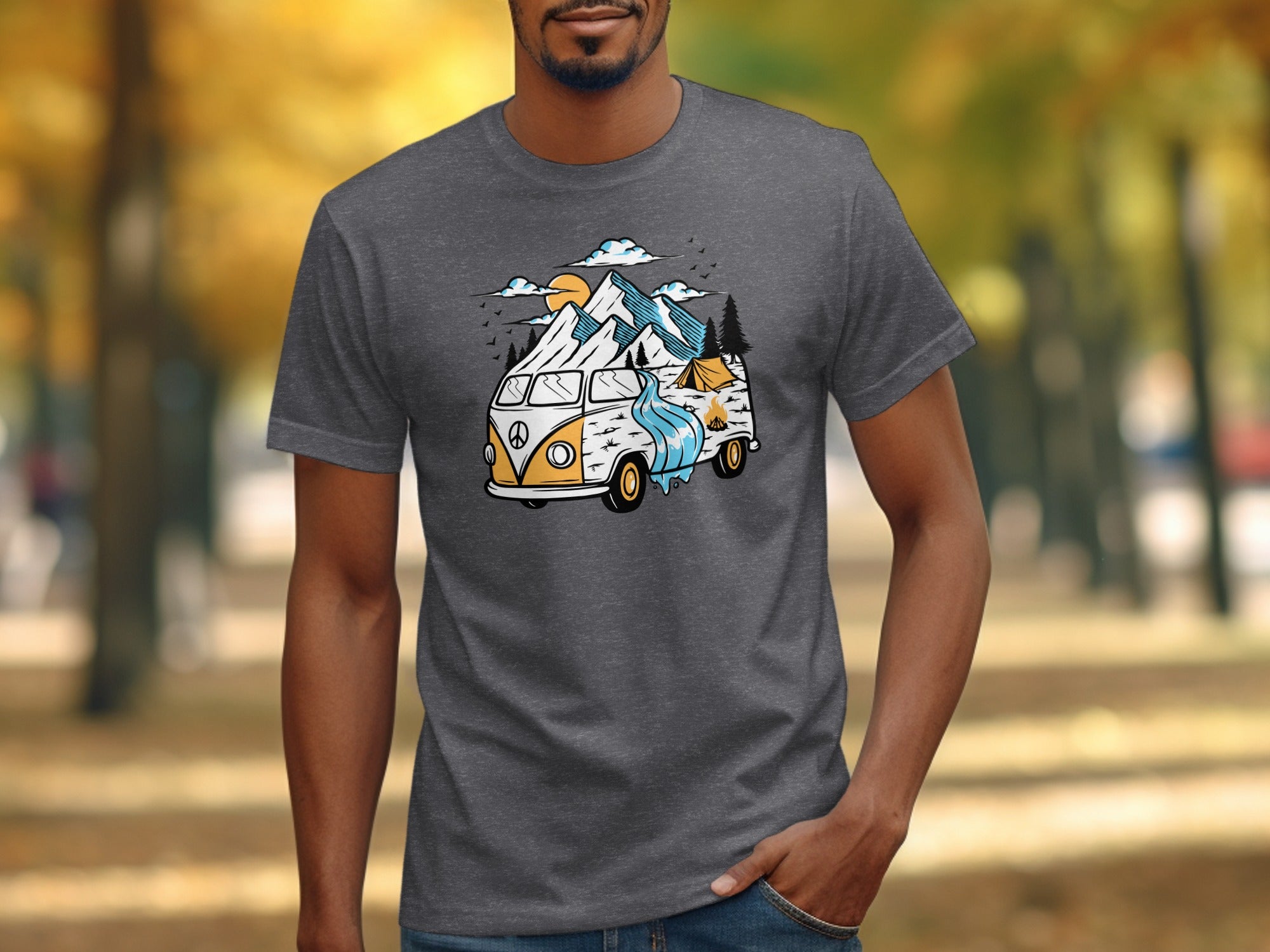 T-shirt with graphic of camper van, mountains, waterfall, and tent scene.