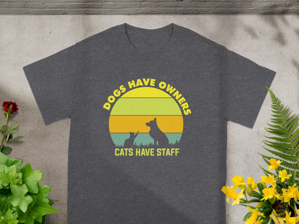 Dark grey t-shirt with text "Dogs Have Owners, Cats Have Staff" and silhouette.