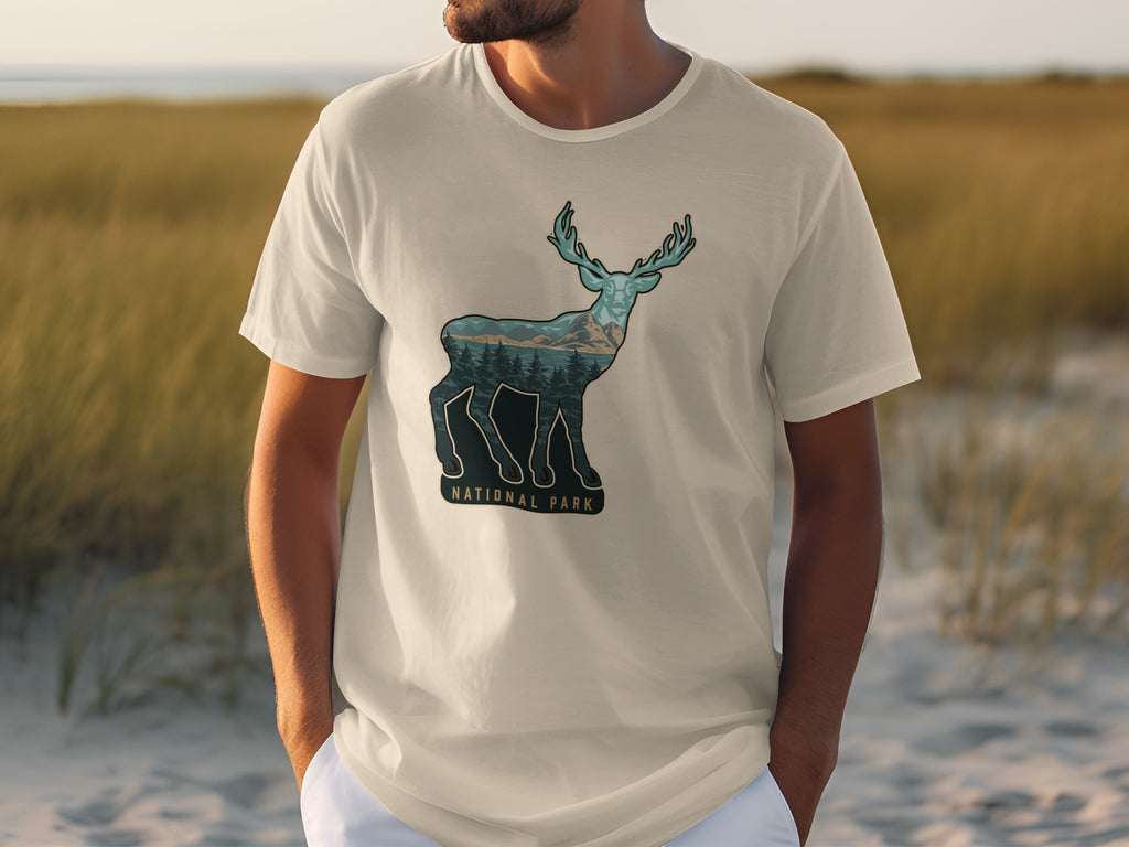 T-shirt with graphic of deer silhouette filled with mountain and forest scene, text National Park.