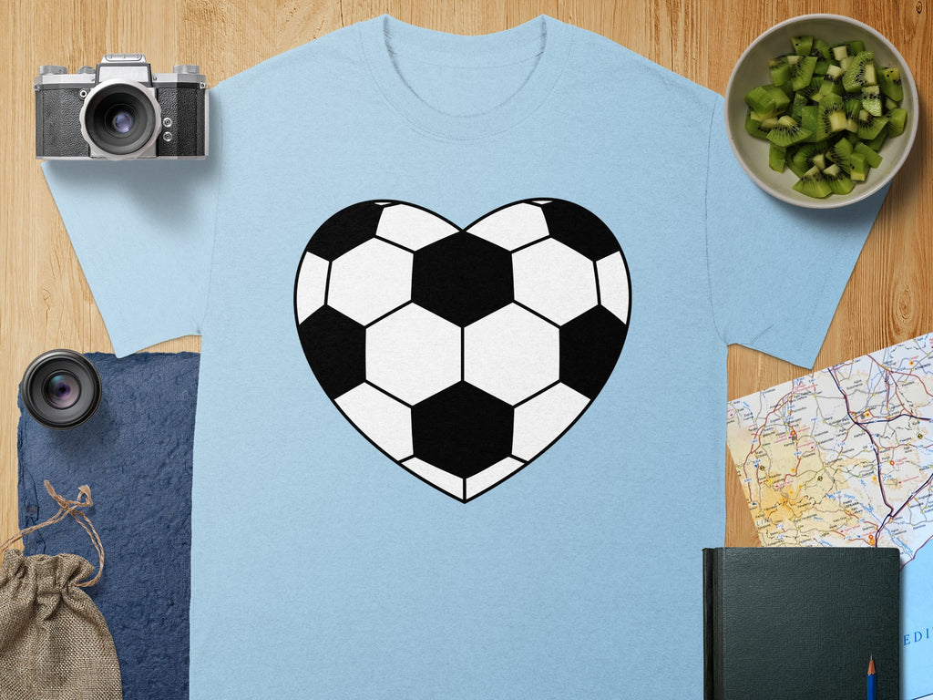 Light blue t-shirt with a black and white soccer ball heart graphic.