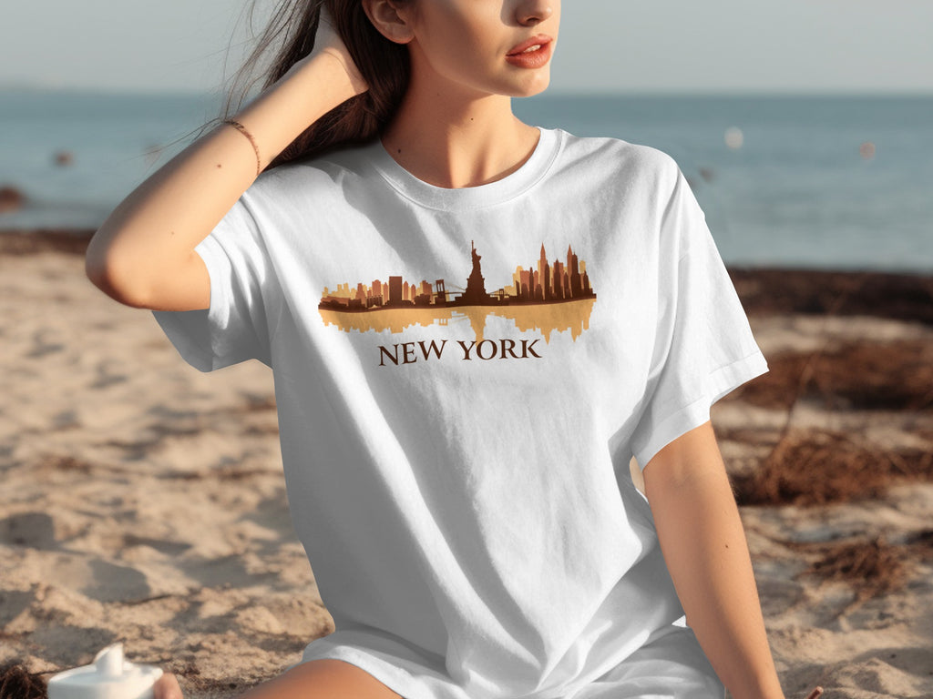 White t-shirt with brown New York City skyline graphic and text.