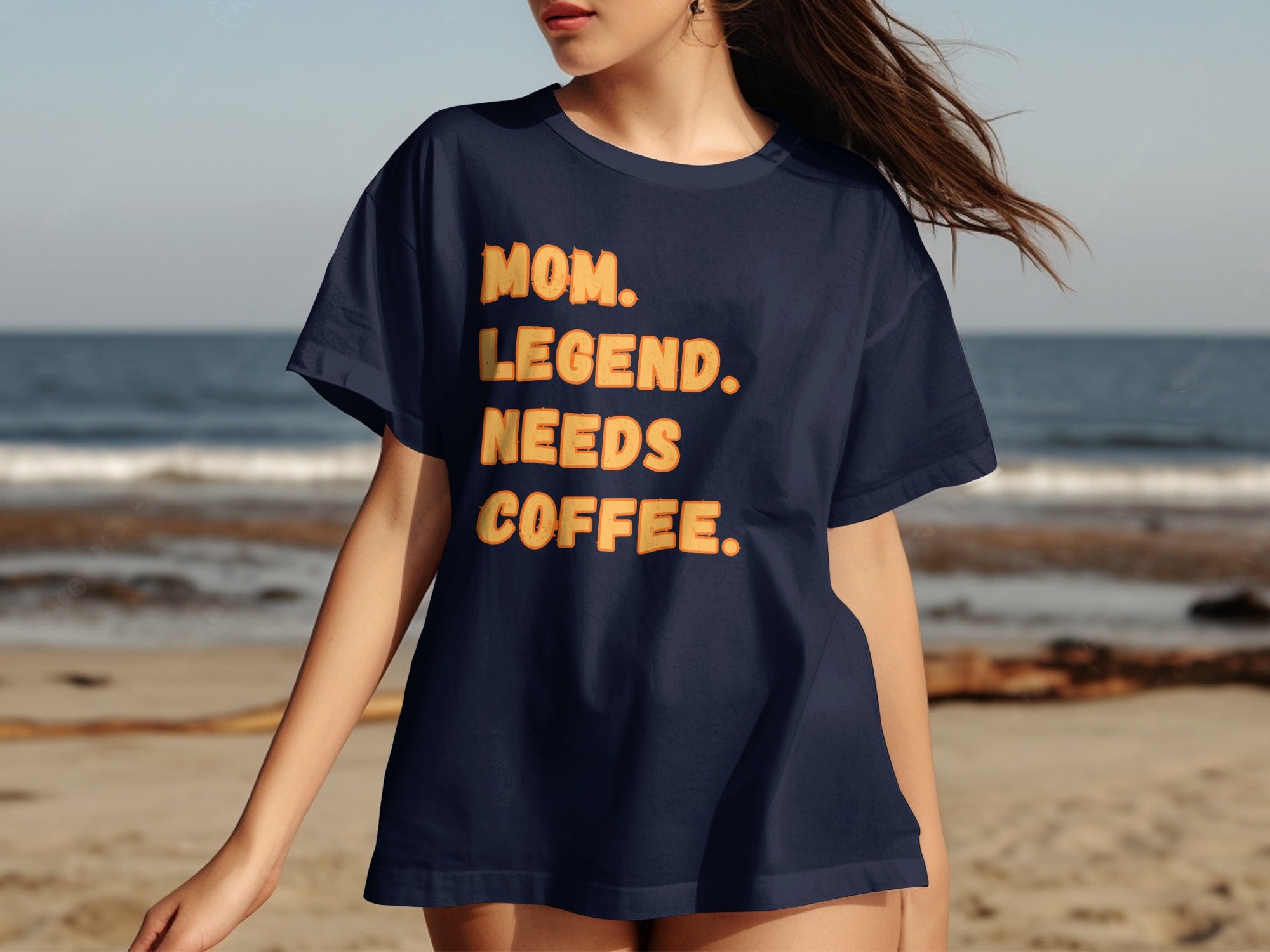 Navy t-shirt with orange text reading "MOM. LEGEND. NEEDS COFFEE."