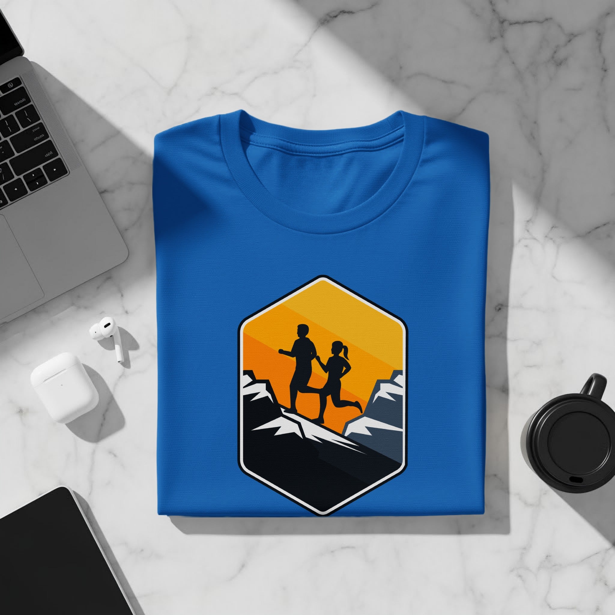 Blue t-shirt with a hexagonal graphic of two runners over mountains.