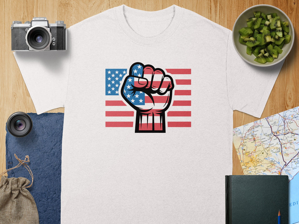 White t-shirt with American flag fist graphic and red stripes.