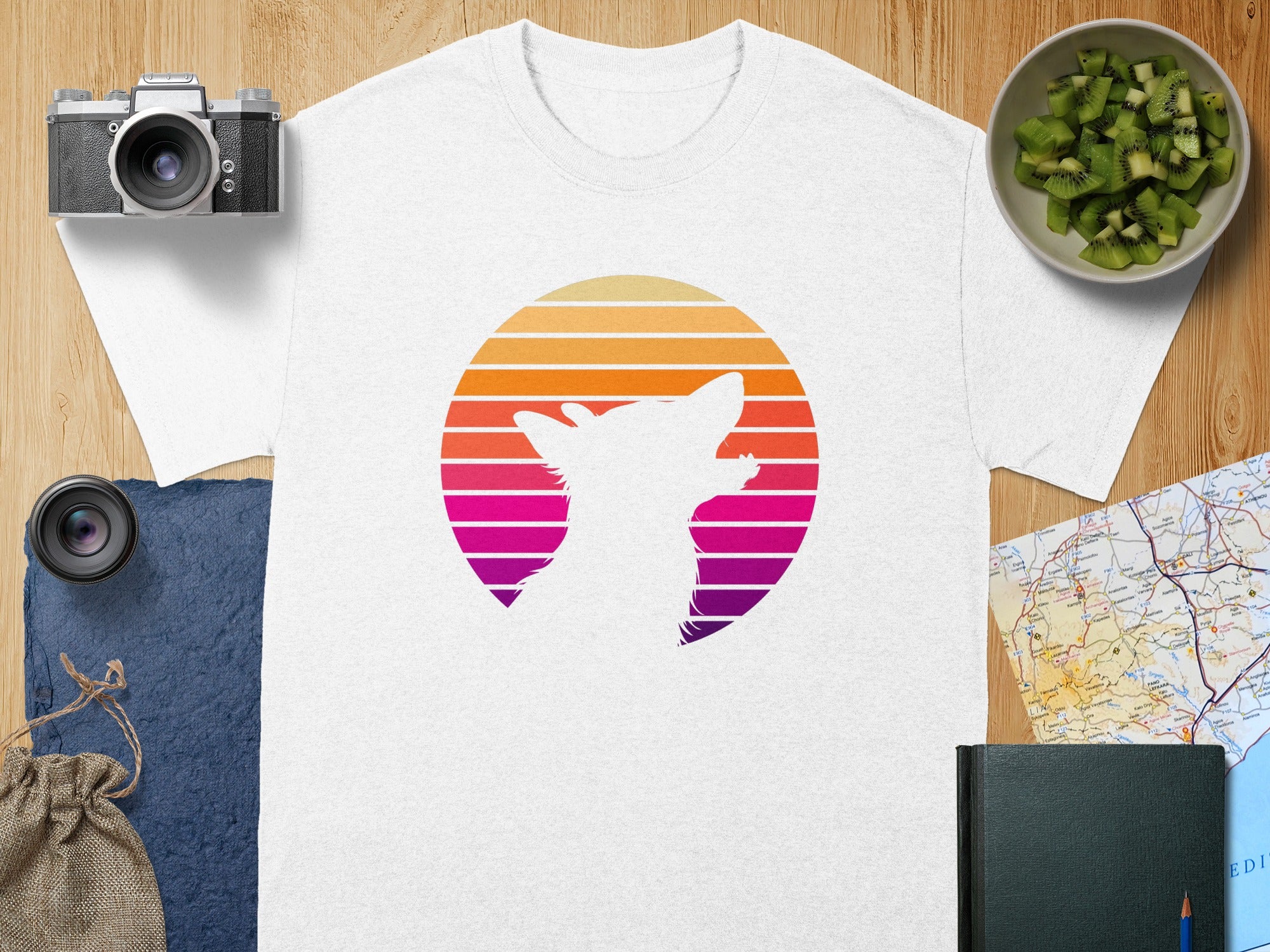 White t-shirt featuring a white cat silhouette within a retro sunset graphic.