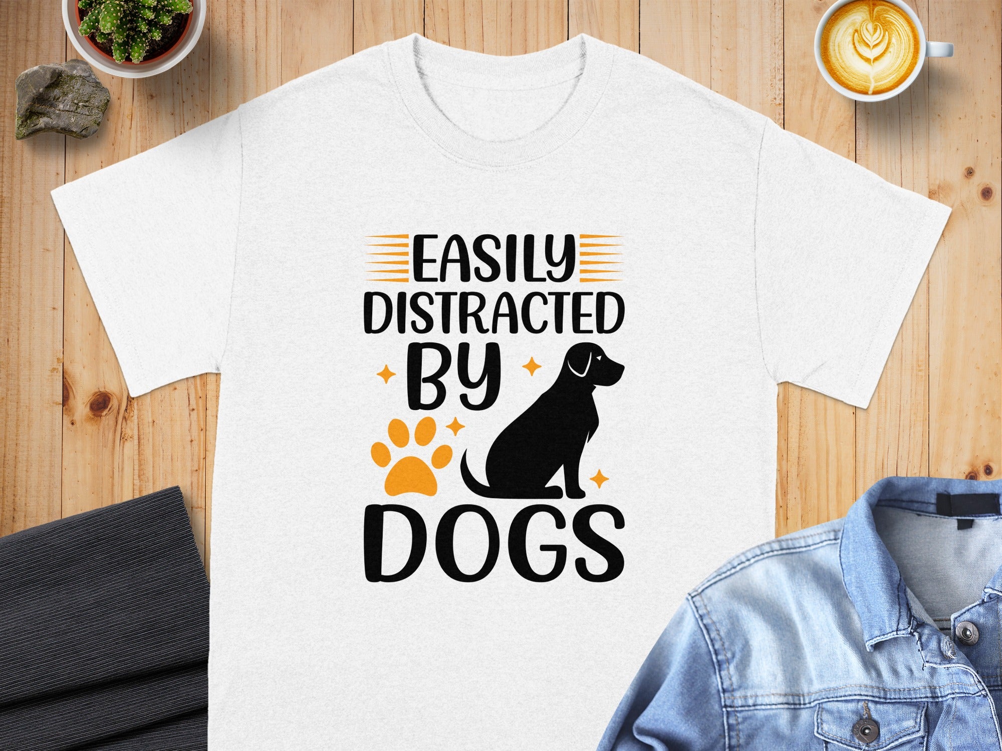 White t-shirt with "Easily Distracted By Dogs" text, dog silhouette, and paw print.