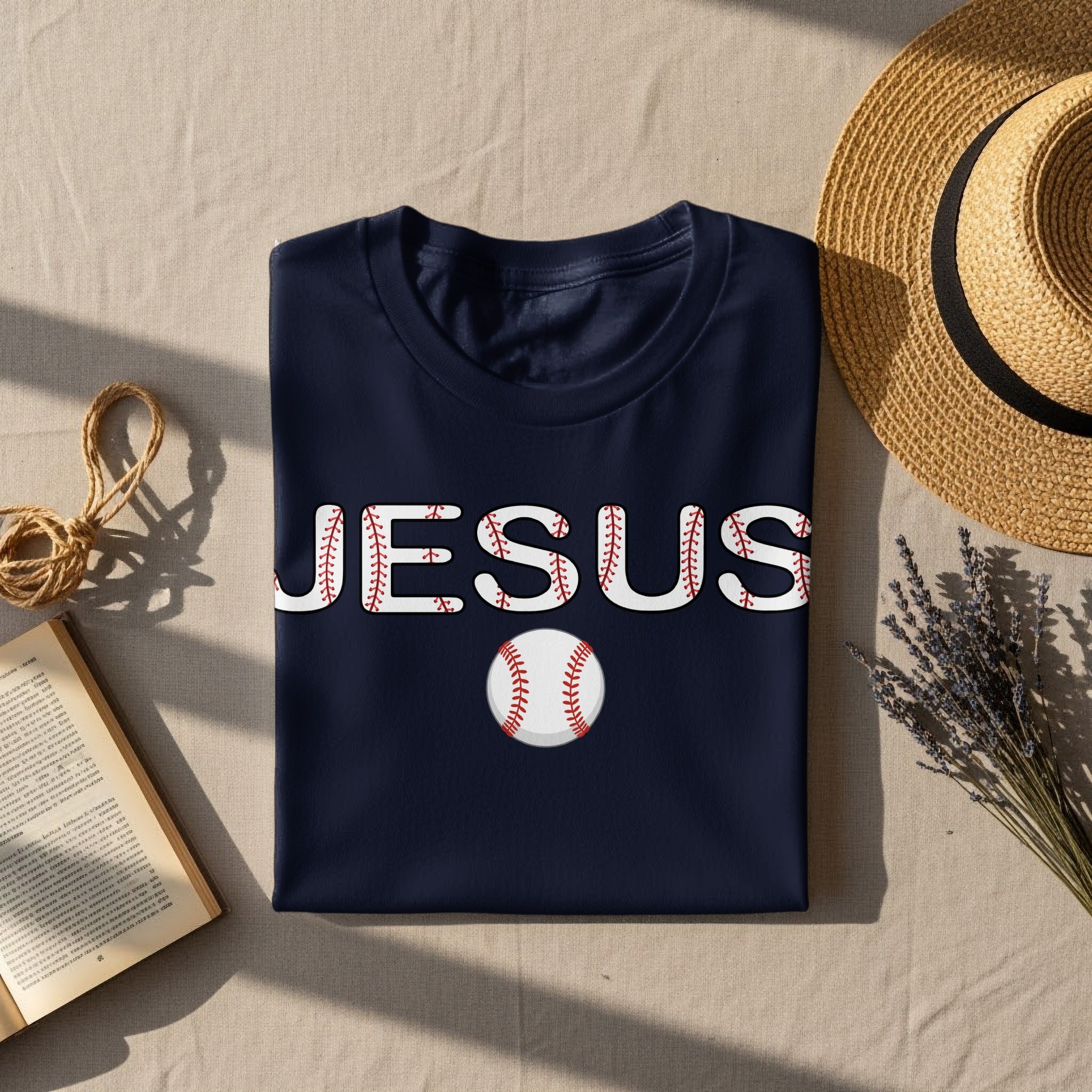 Navy t-shirt with "JESUS" in baseball stitching and a baseball graphic.