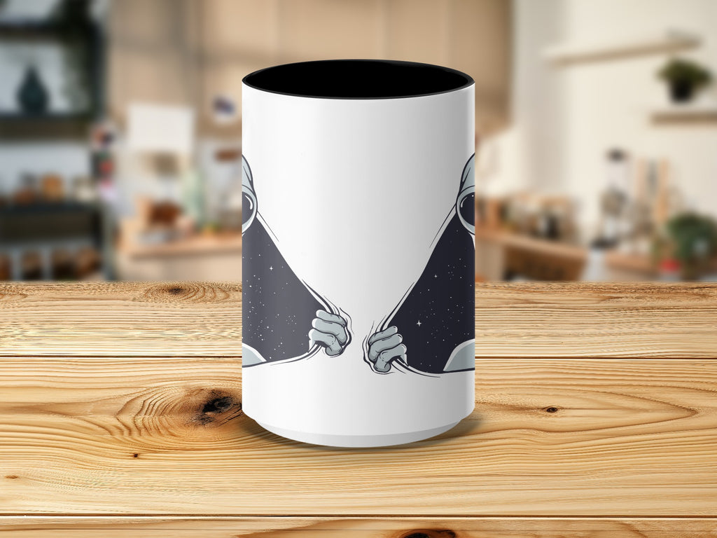 White mug with black interior features astronaut hands pulling open a starry space scene.