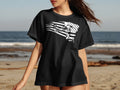 Black t-shirt with a white graphic of a soccer player kicking a ball against an American flag.