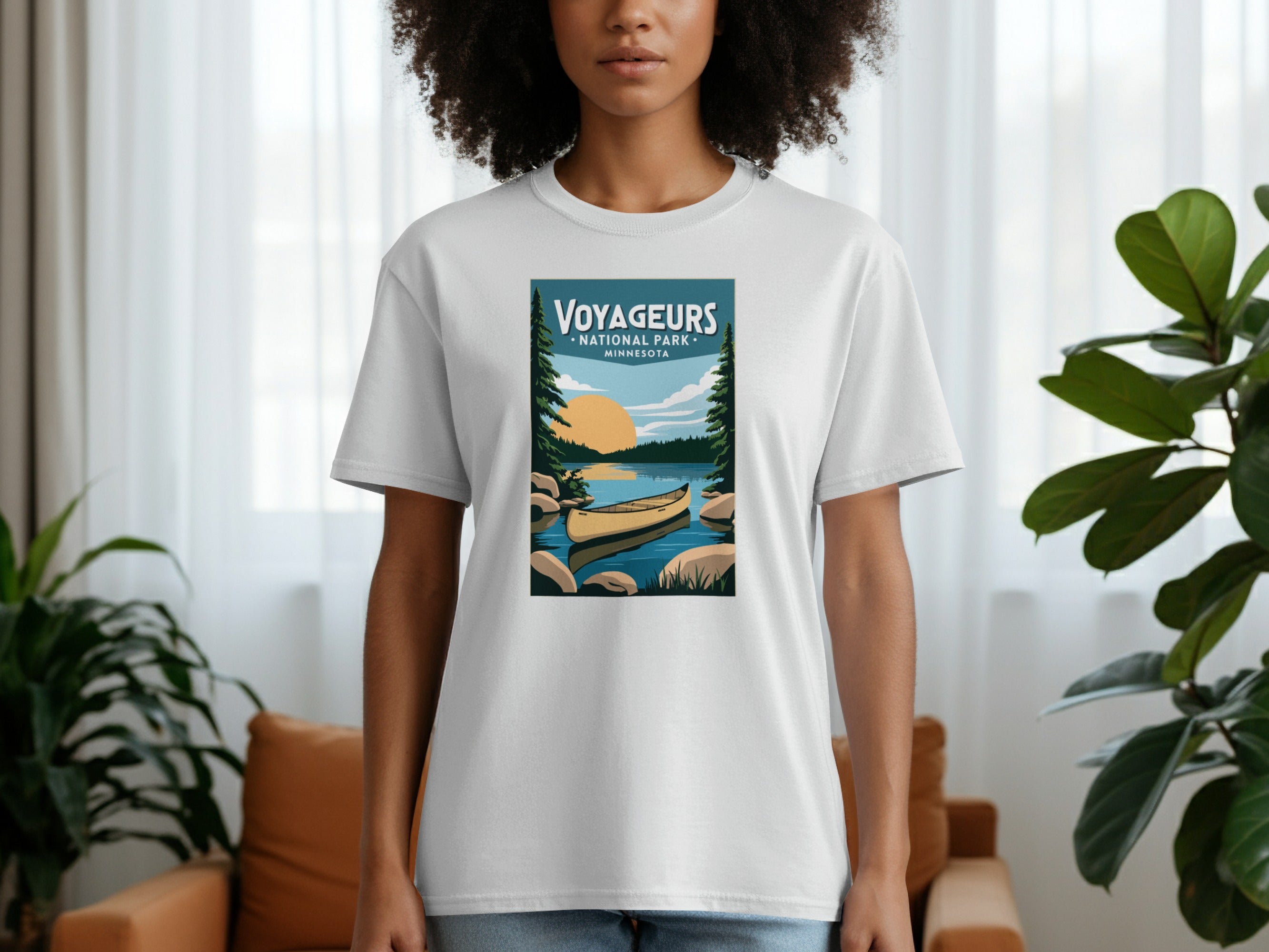 White t-shirt with Voyageurs National Park Minnesota graphic featuring a canoe and sunset.