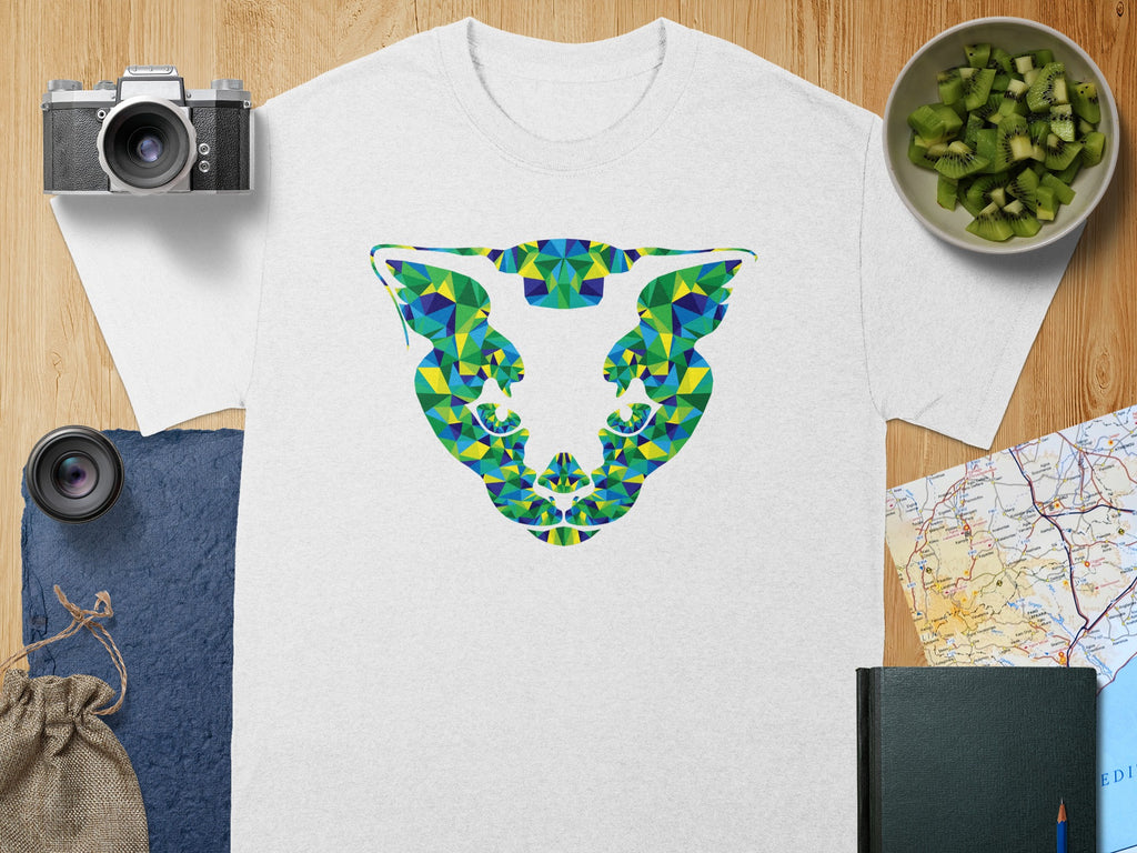 White t-shirt with geometric animal skull graphic in blue, green, and yellow.