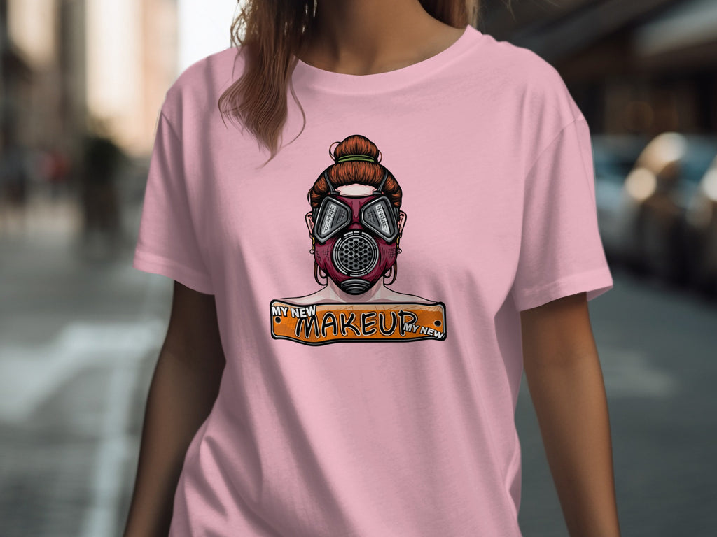 Pink t-shirt with graphic of a woman wearing a gas mask and text "My New Makeup".