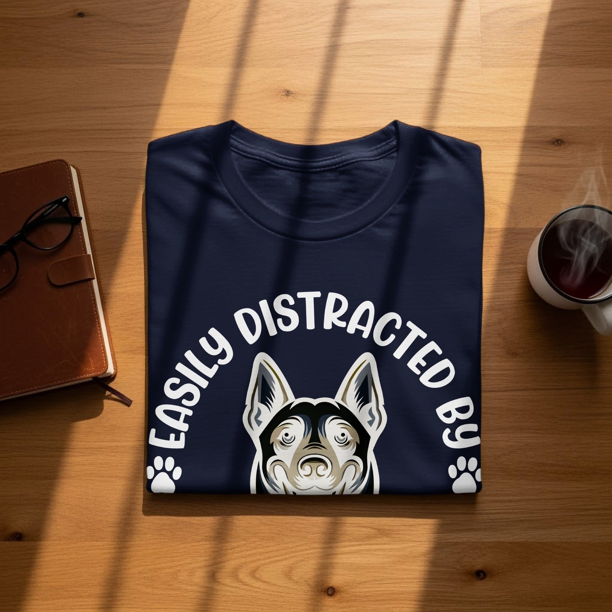 Dark blue t-shirt with white text "EASILY DISTRACTED BY" and dog portrait.