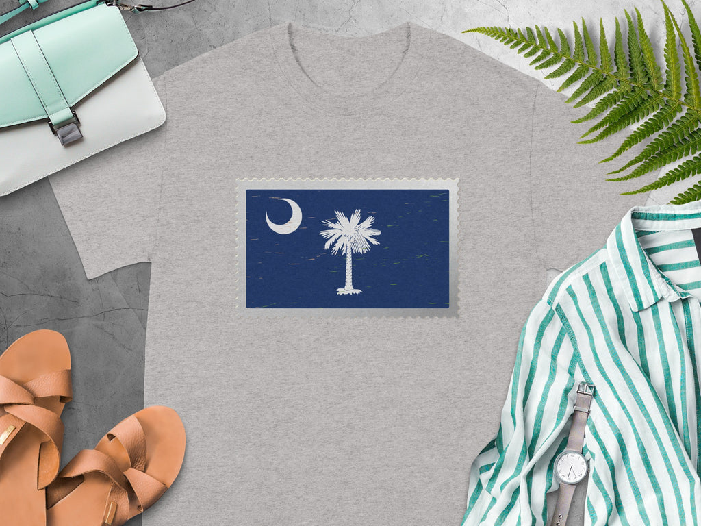 Grey t-shirt with a postage stamp featuring the South Carolina flag emblem.