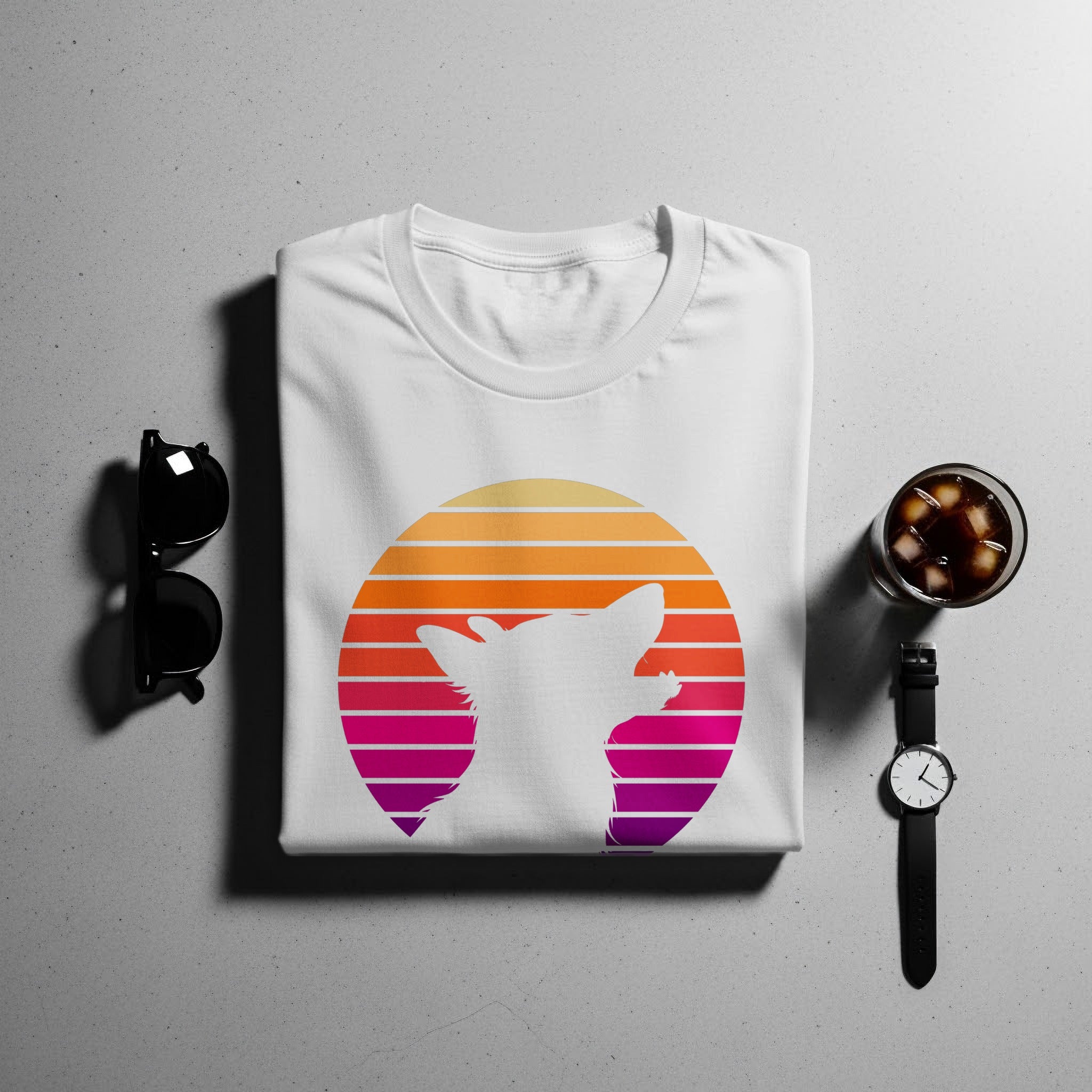 White t-shirt with a white cat silhouette inside a sunset gradient circle.
