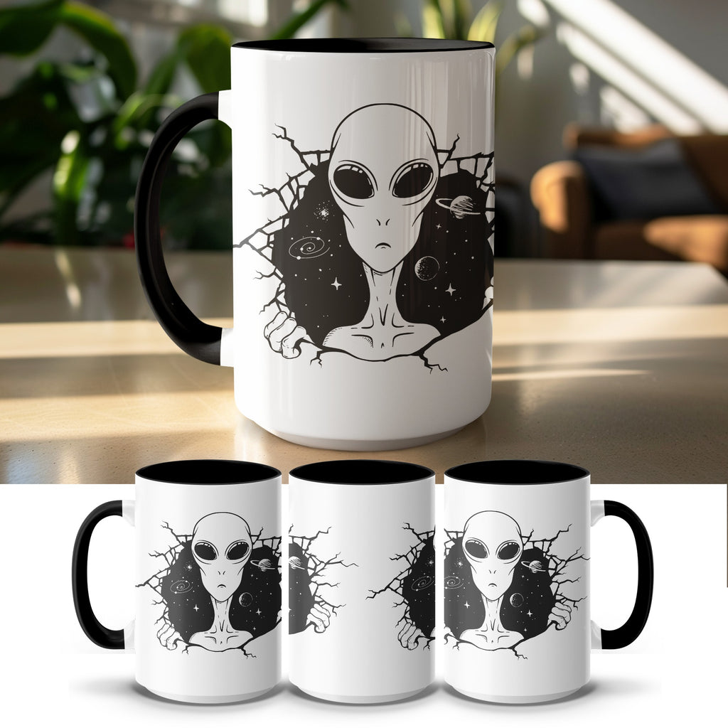 White mug with a black interior and handle featuring an alien bursting through a cracked space scene.