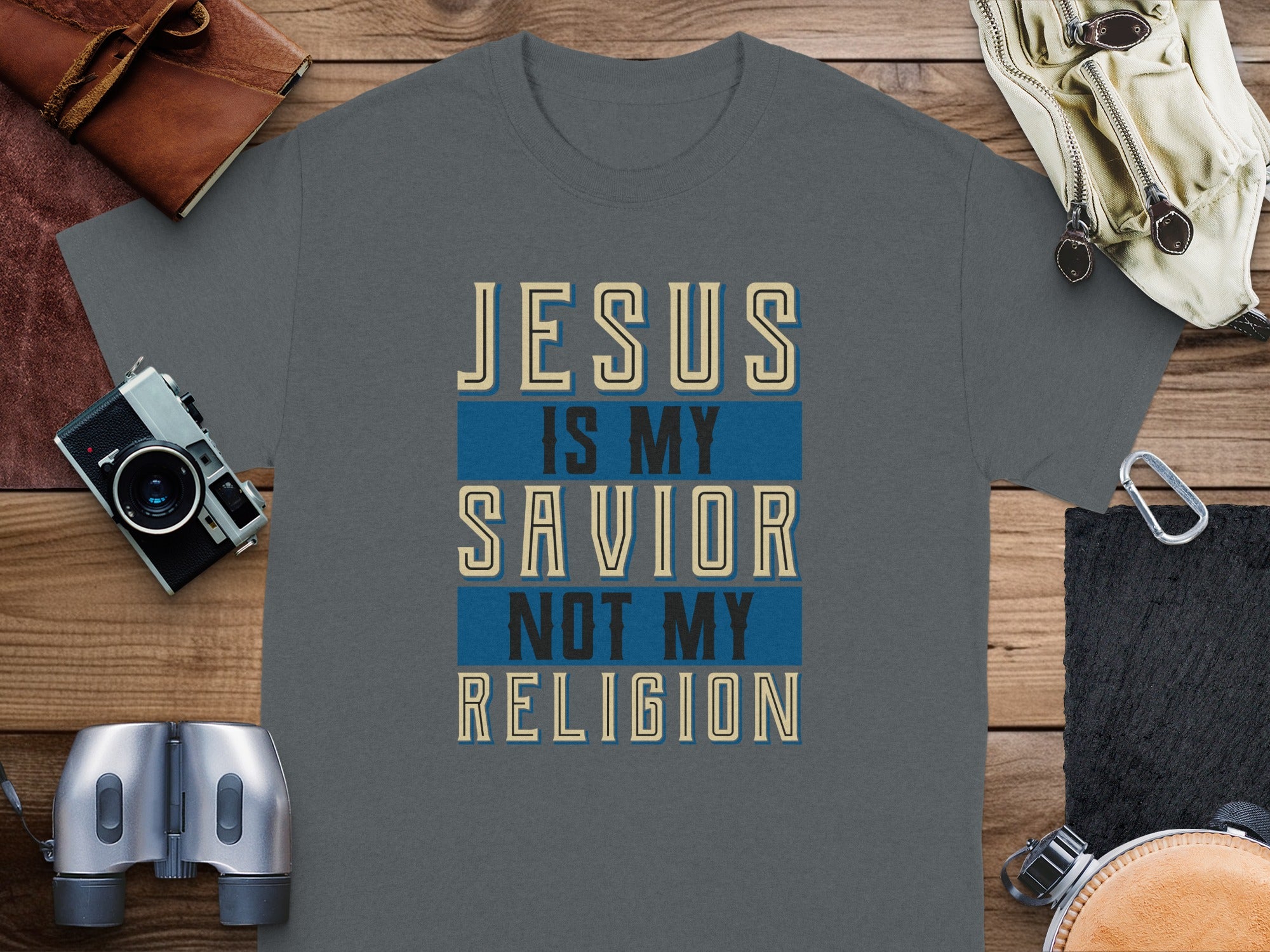 Dark gray t-shirt with "JESUS IS MY SAVIOR NOT MY RELIGION" text.
