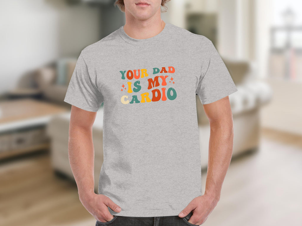 Grey t-shirt with colorful retro text reading "Your Dad Is My Cardio".