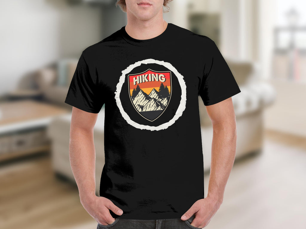 Black t-shirt with a distressed shield graphic featuring mountains, trees, and the word "Hiking."