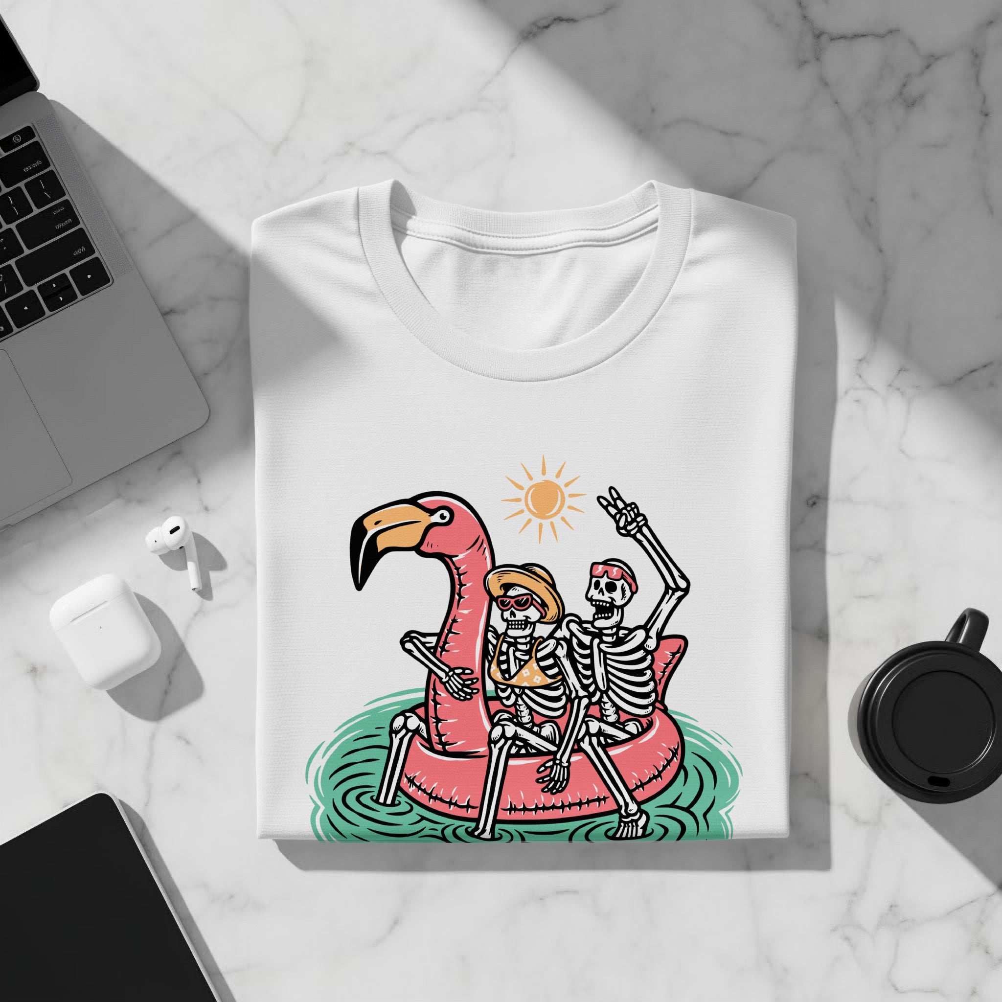 T-shirt featuring two skeletons on a flamingo inflatable under a sun.