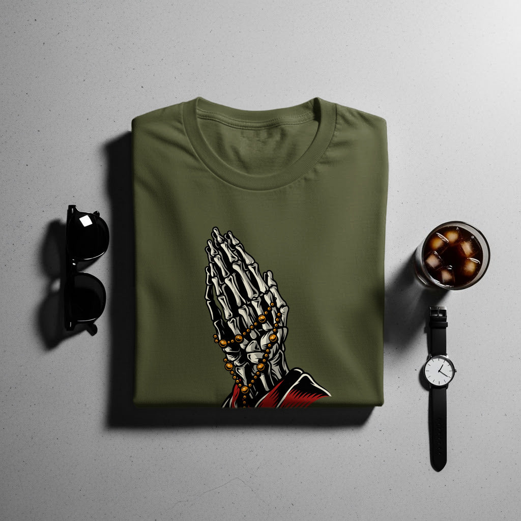 Olive green t-shirt with praying skeleton hands graphic and gold beads.