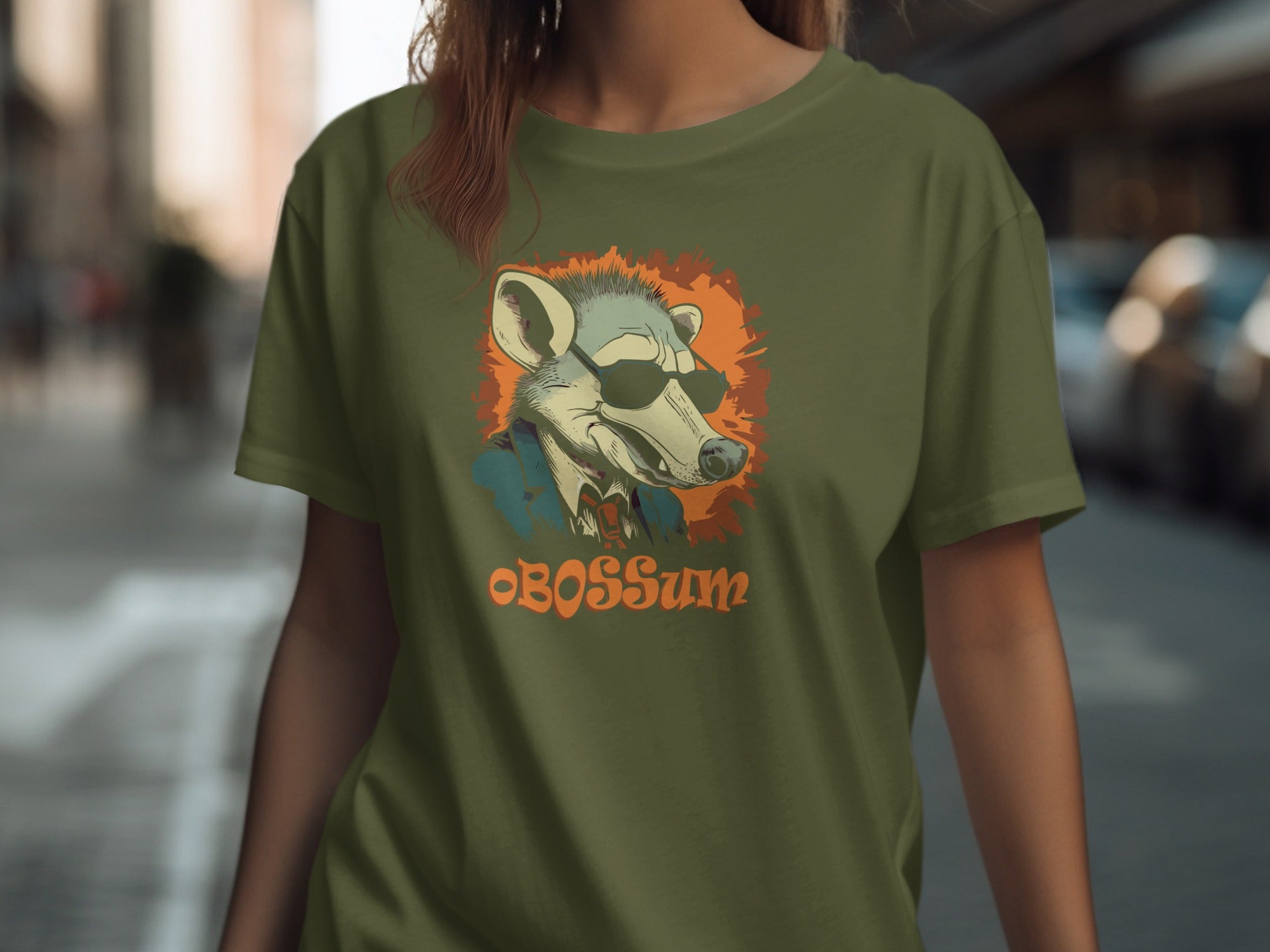 Green t-shirt with a stylized possum wearing sunglasses and a bowtie, text OBOSSUM.