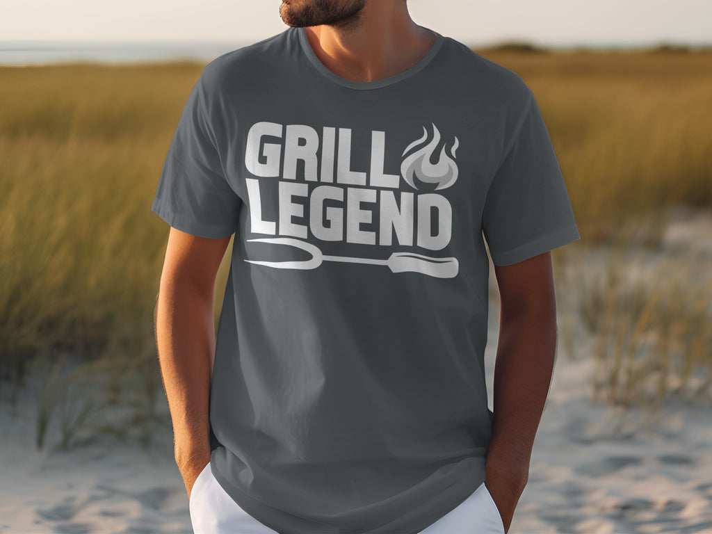 Dark grey t-shirt with white text "GRILL LEGEND" and grilling fork graphic.