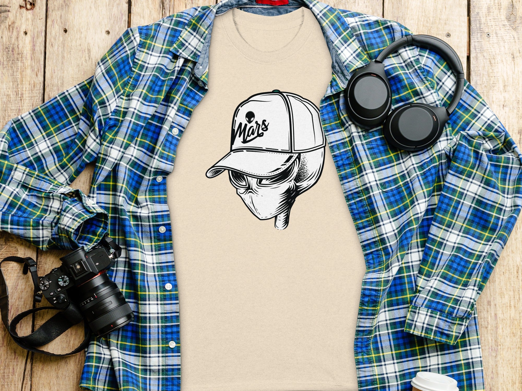 Beige t-shirt with an alien wearing a "Mars" baseball cap graphic.