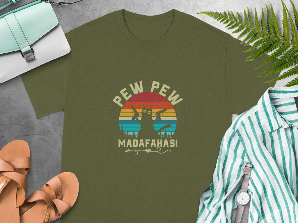 Olive t-shirt with a cat holding guns and "Madafakas!" text.