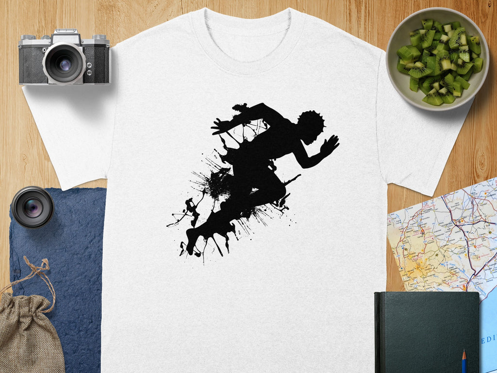 White t-shirt with black graphic silhouette of a runner abstractly rendered with paint splatters.