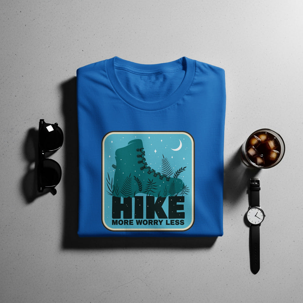Blue t-shirt with a graphic of a hiking boot and the words "HIKE MORE WORRY LESS".