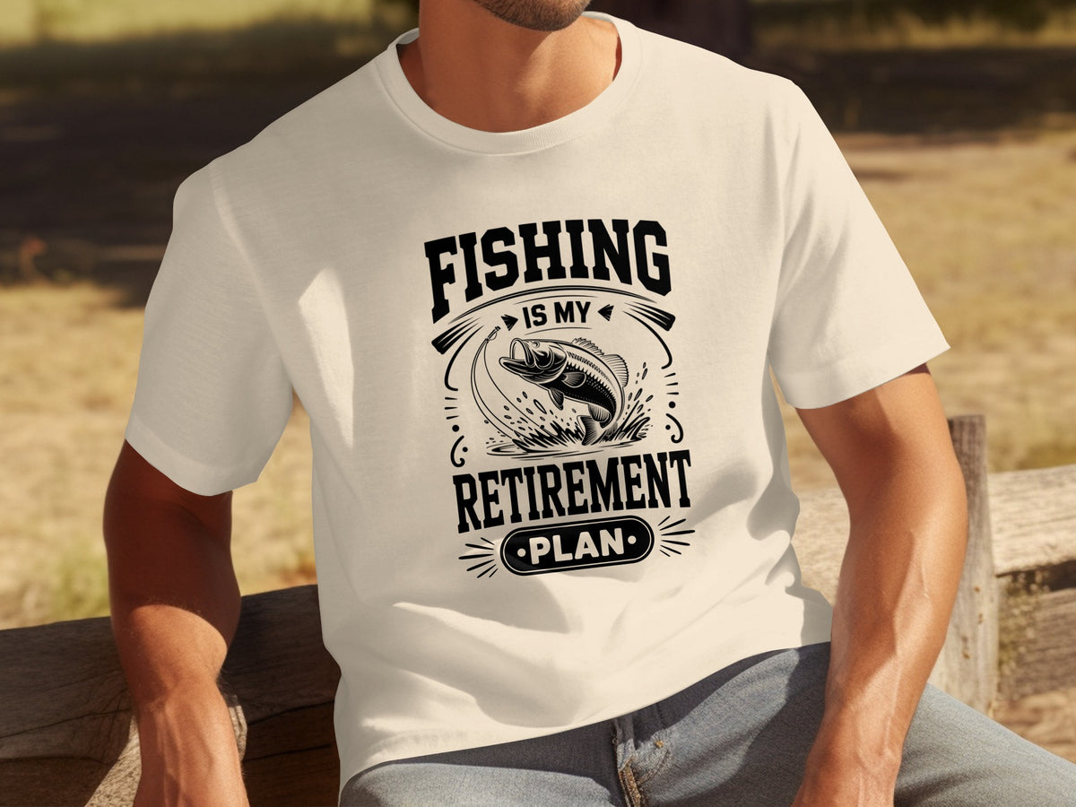 White t-shirt with black graphic: "Fishing is my retirement plan" and a leaping fish.