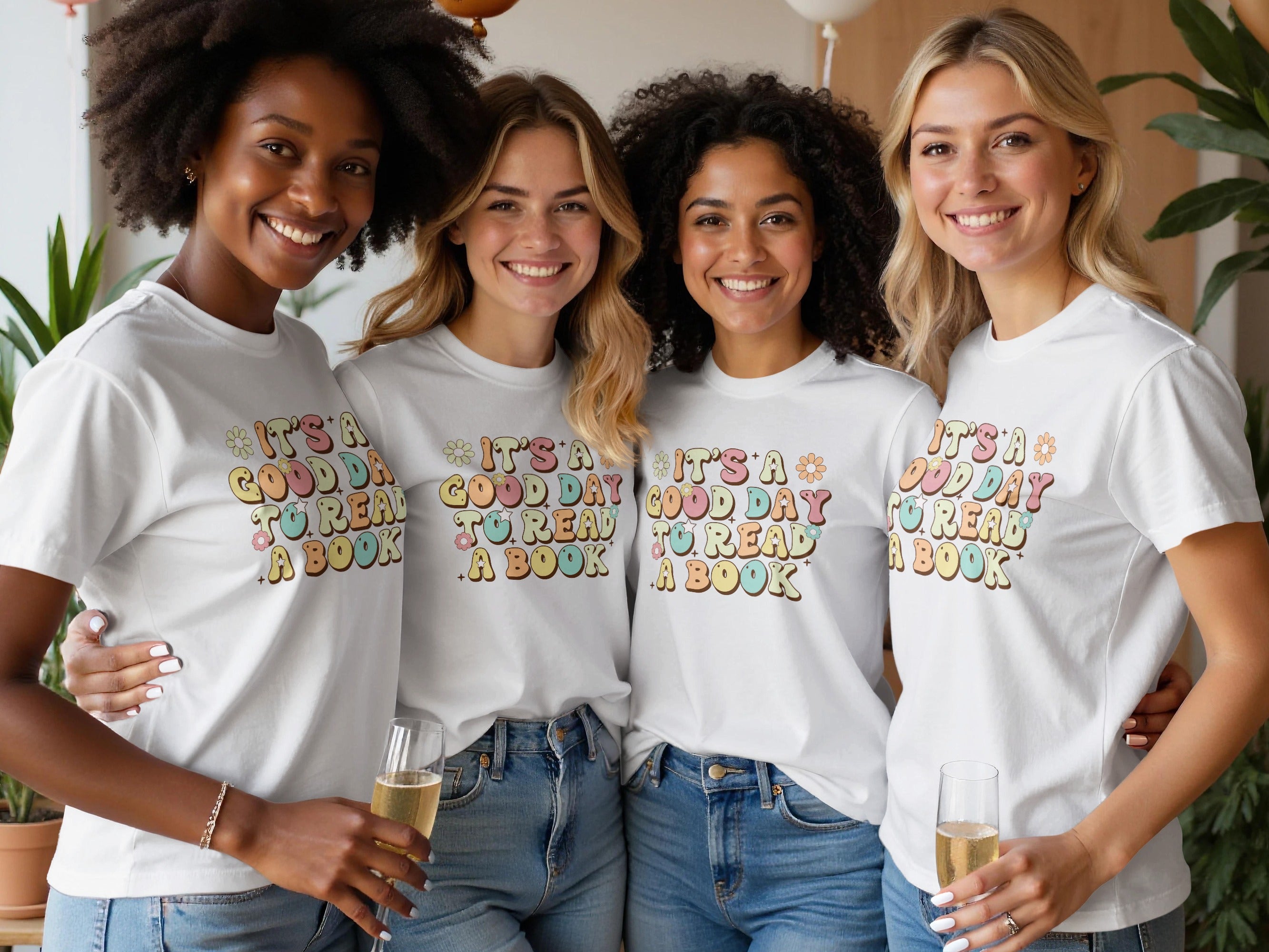 Four women wear white t-shirts with "It's a good day to read a book" text.