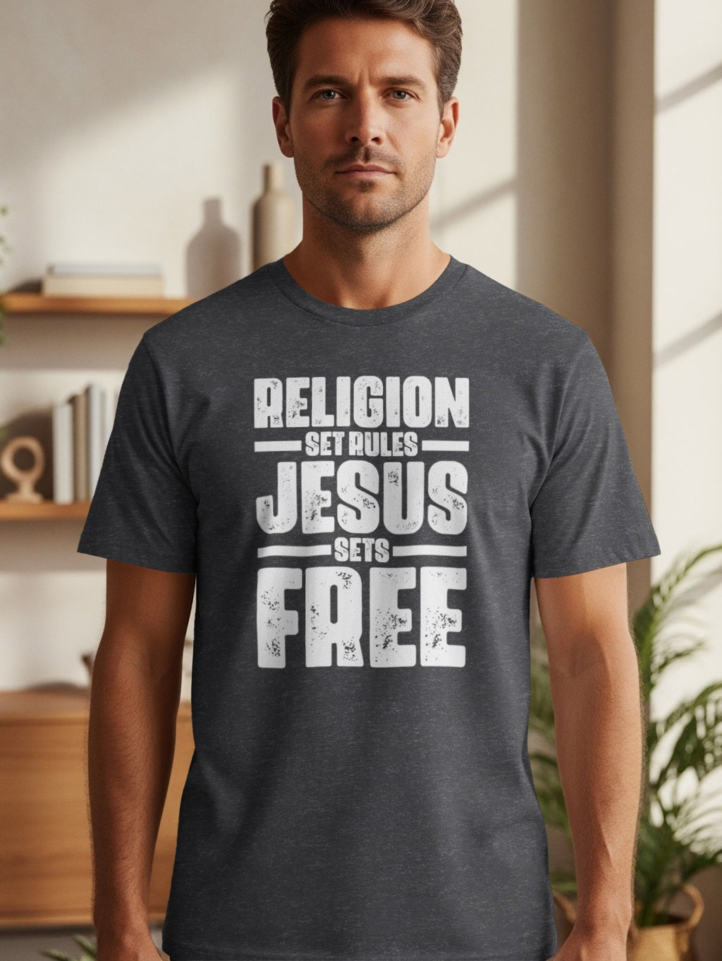 Dark grey t-shirt with white text "RELIGION SET RULES JESUS SETS FREE".