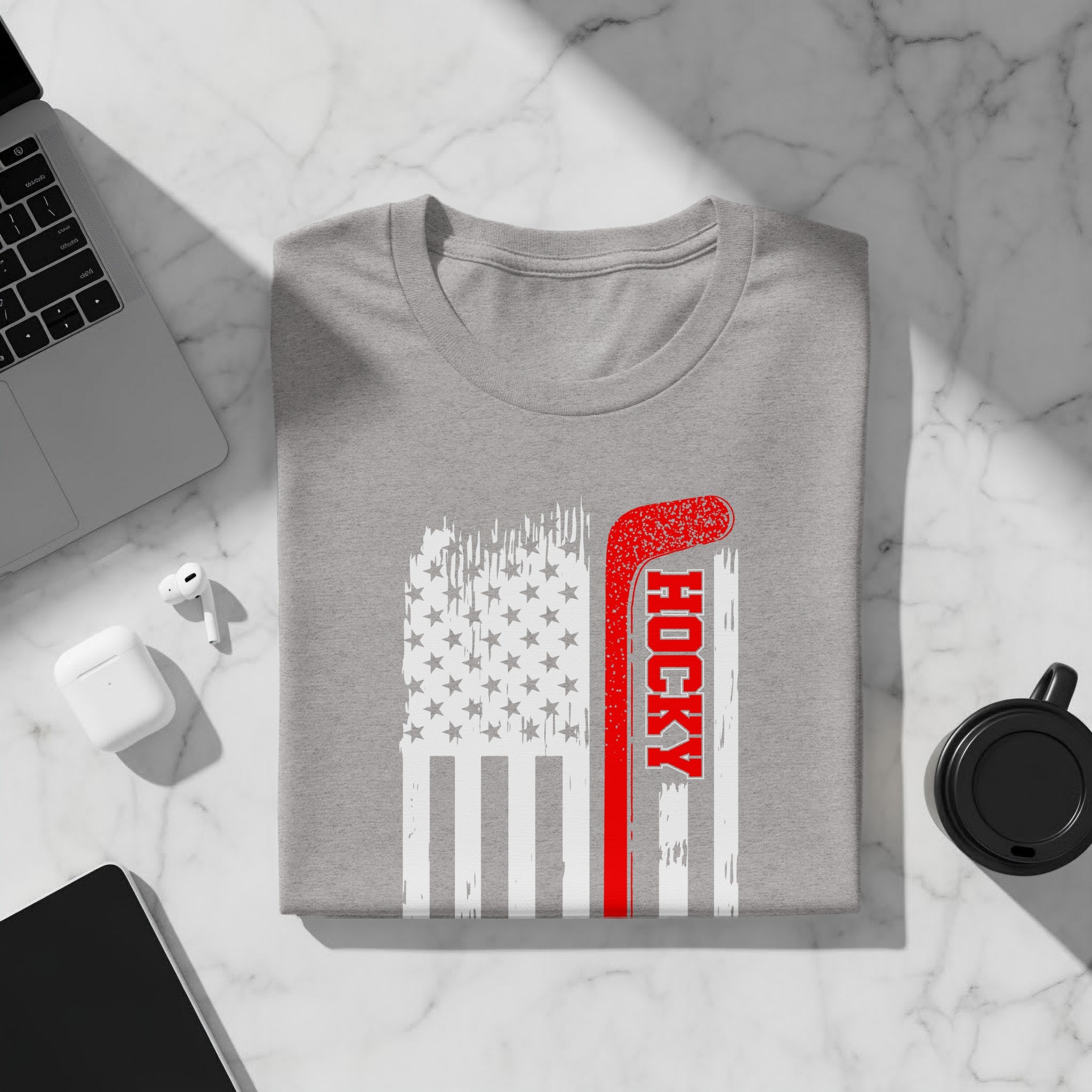 Gray t-shirt with distressed American flag and red hockey stick graphic.