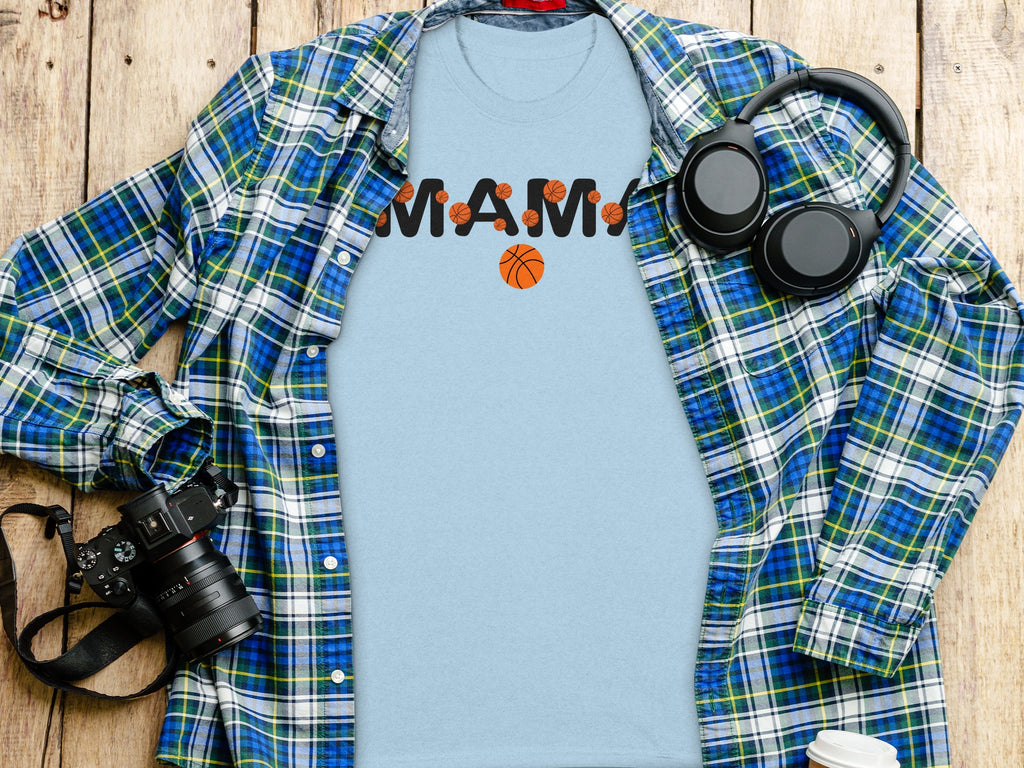 Light blue t-shirt with black "MAMA" text and basketball graphics.