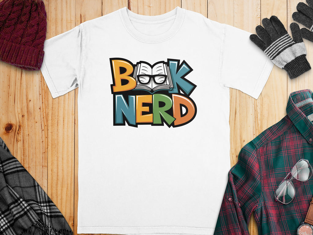 White t-shirt with "Book Nerd" text in colorful block letters and an open book graphic.