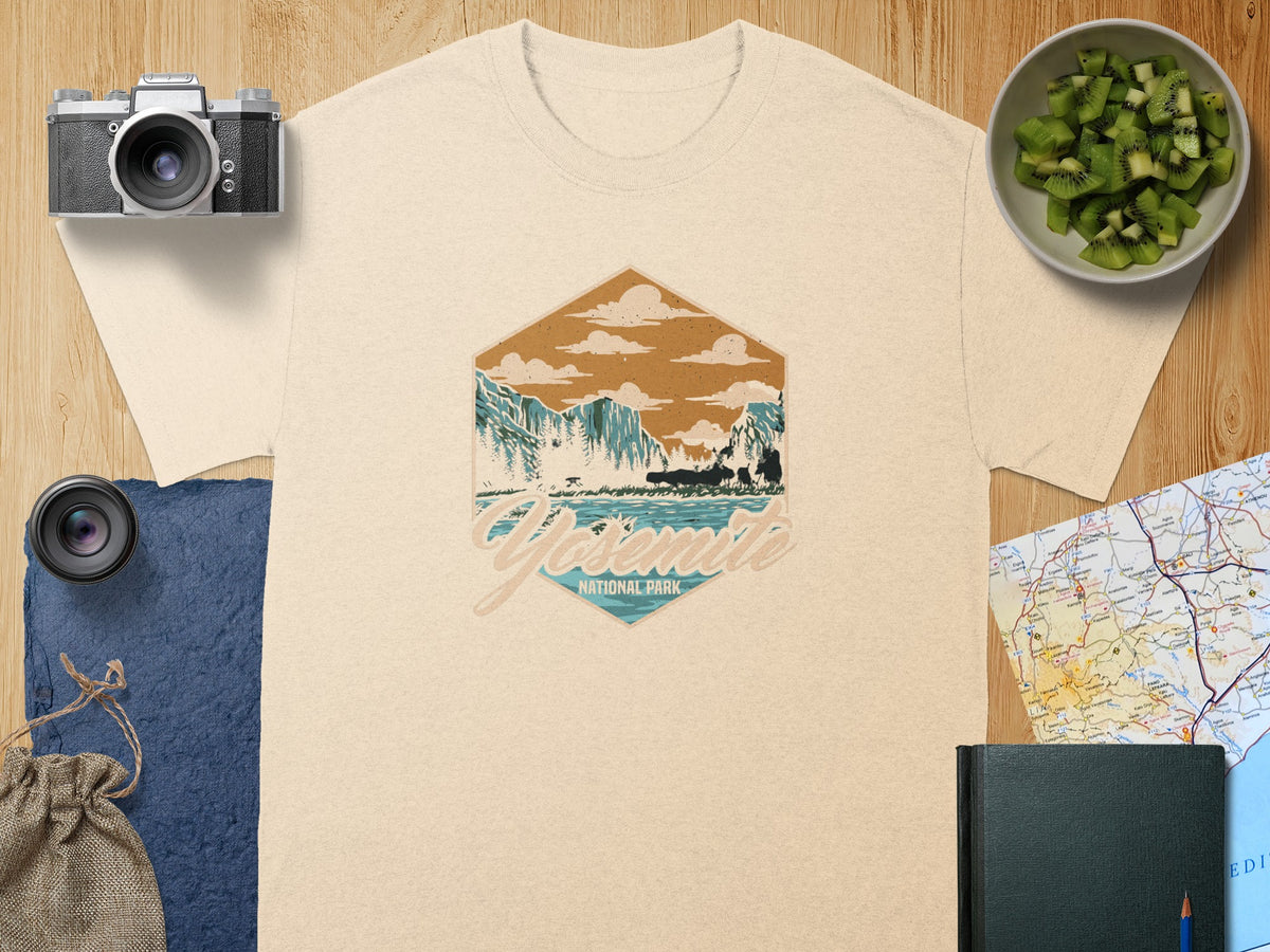 Cream t-shirt with Yosemite National Park graphic featuring mountains, trees, and a lake.