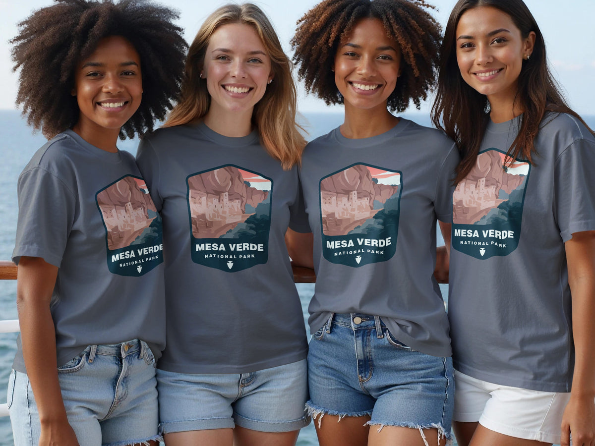 Four women wear gray t-shirts with a Mesa Verde National Park graphic.
