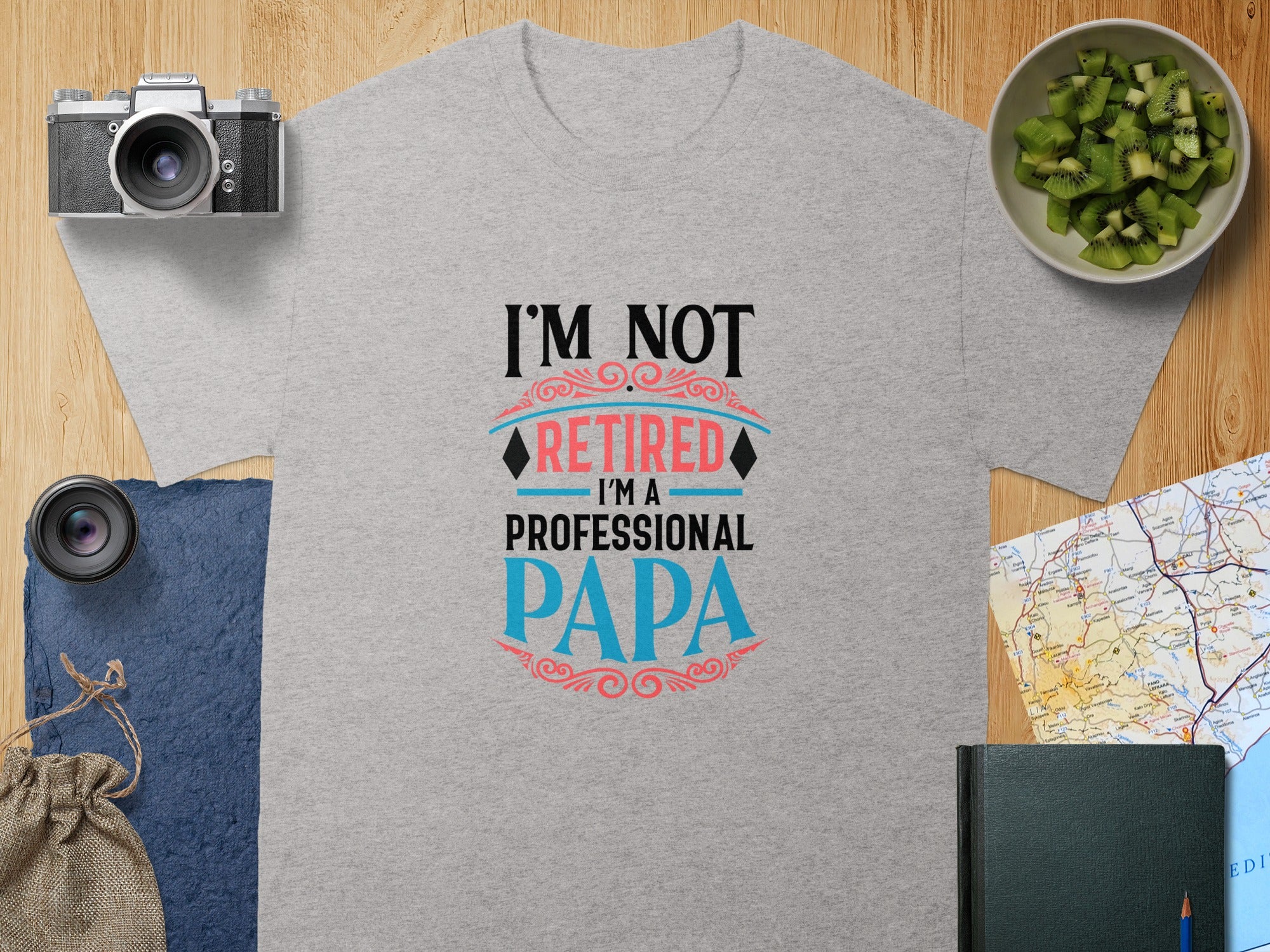 Gray t-shirt with "I'm Not Retired, I'm a Professional Papa" text.