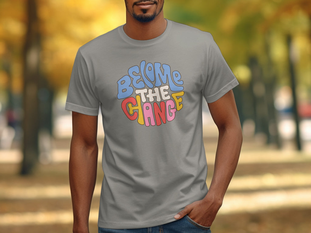 Grey t-shirt with colorful "BECOME THE CHANGE" text in retro bubble font.