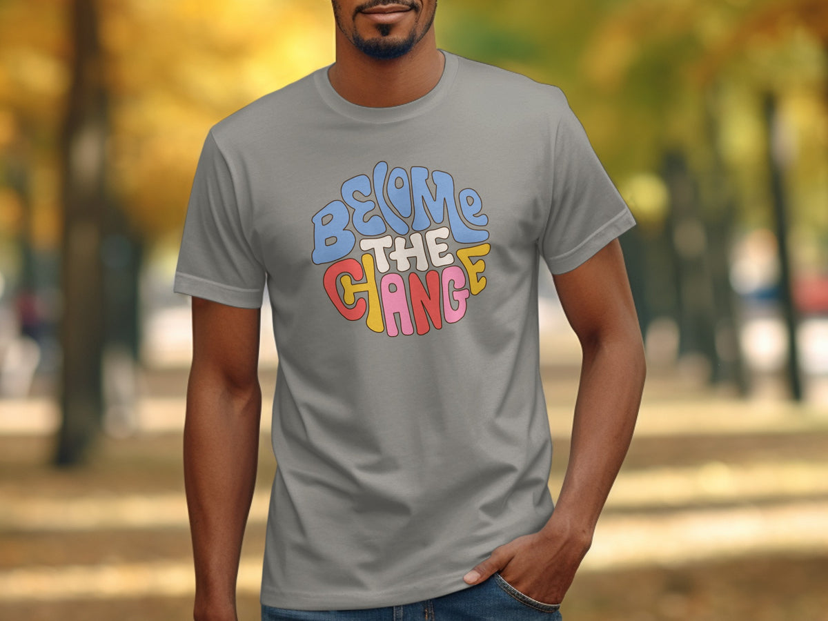 Grey t-shirt with colorful "BECOME THE CHANGE" text in retro bubble font.